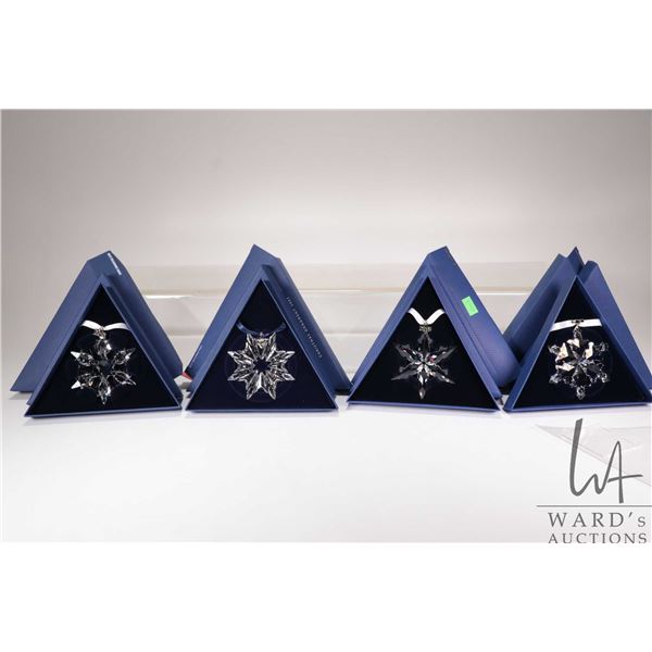 Four Swarovski Crystal collectible snowflakes including 2003, 2010, 2012 and 2015