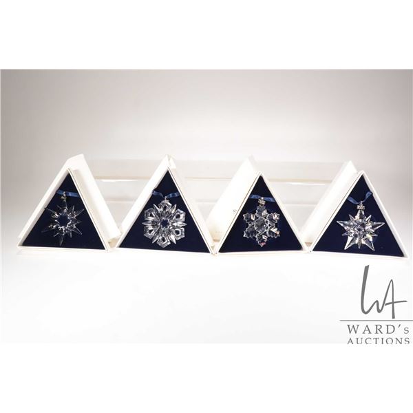 Four Swarovski Crystal collectible snowflakes 1996, 1997, 1999 and 2001