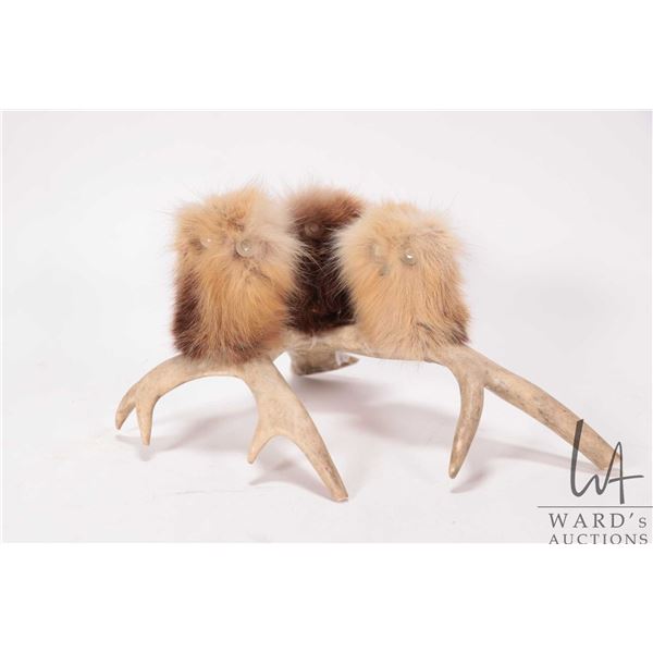 Three hand crafted sealskin Ookpik owls on antler platform, 5" H X 10" L