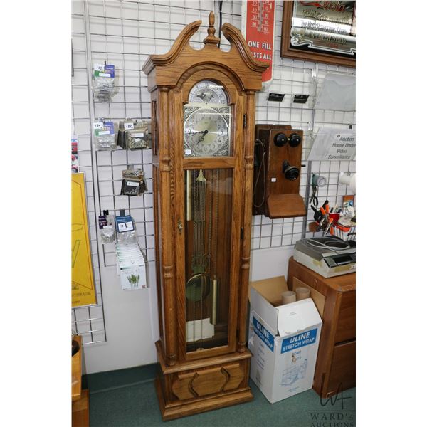 Oak cased Howard Miller Ridgeway triple chain, chiming grandfather clock, working at time of catalog