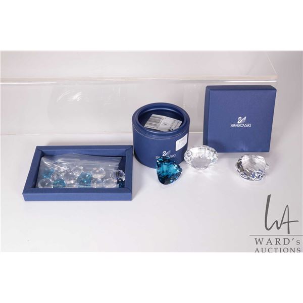 Four Swarovski crystal clamshells including 2 X 833506 ( one without box) plus 833575 and 844184