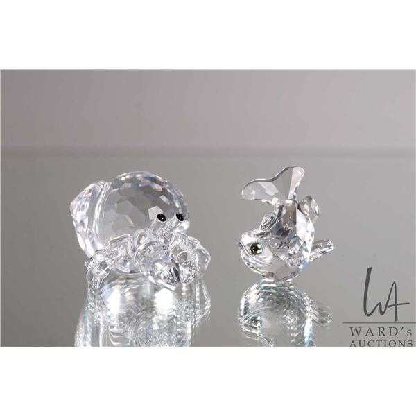 Two Swarovski crystal figures including "Jumping Carp" 211743, 1 1/4" and "Hermit Crab" 671837, 1 1/