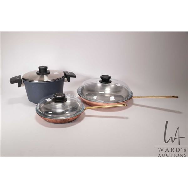 Two Culinox copper and zinc skillets with brass handles and fitted Pyrex glass lids including 7" and