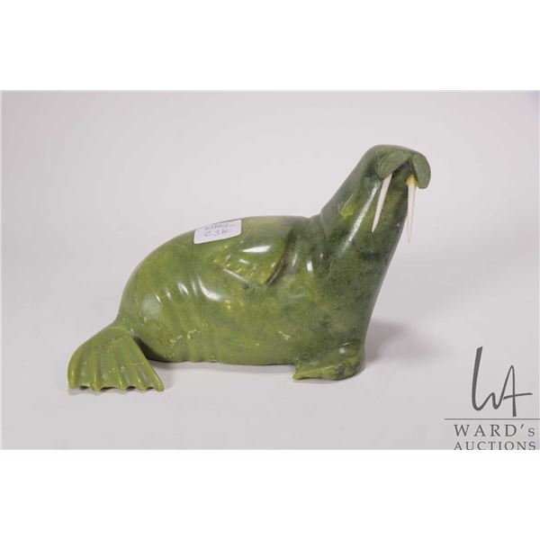 Appa Geeta, artist signed, hand carved green serpentine walrus figure, 8" in length