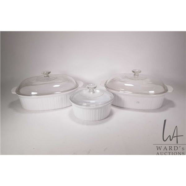 Three Corning Ware lidded casseroles including two French White 4 ltr. and a 1.6 ltr.