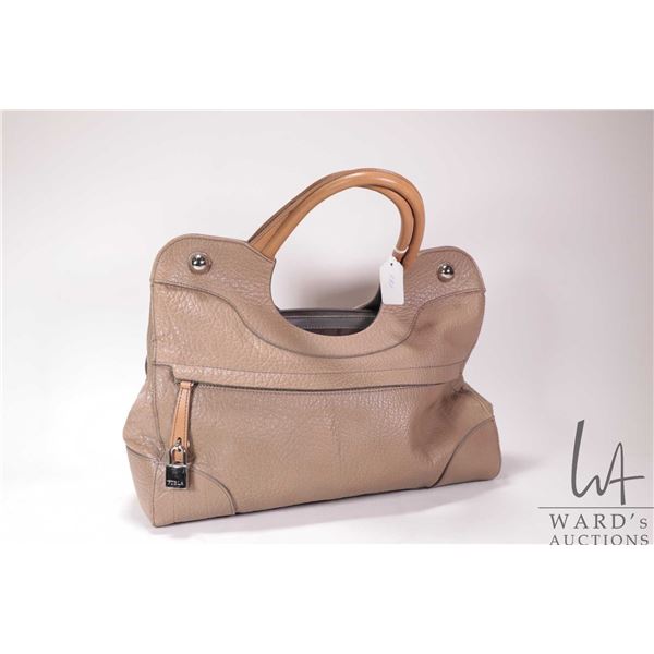 Furla taupe pebbled leather hobo hand bay with silver-tone hardware and lock accents. Note: buyers m