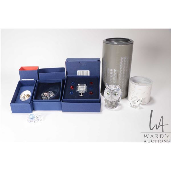 Six Swarovski Crystal figures including Large Owl 010022, small Swarovski swan, perfume bottle 10338