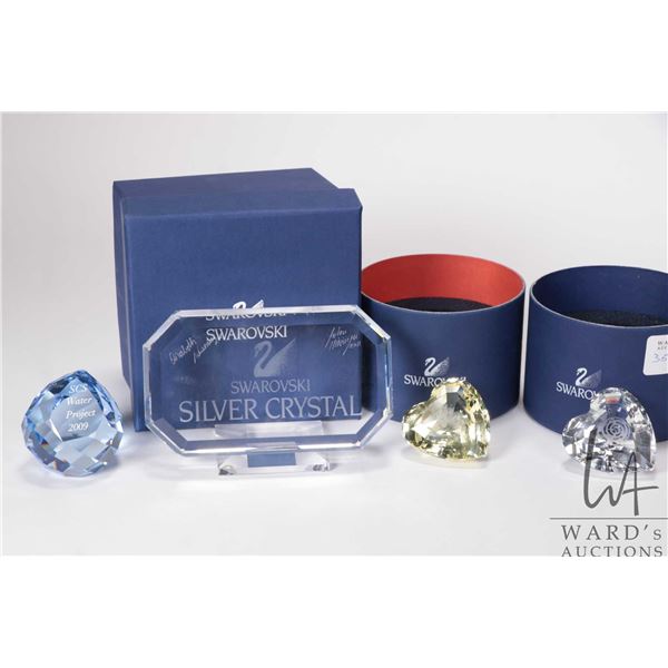 Five Swarovski Crystal plaques/ paperweights including signed Swarovski silver crystal plaque, 2007 