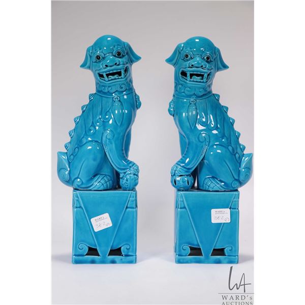 Pair of vintage Chinese turquoise glazed ceramic foo dogs, each 12" in height