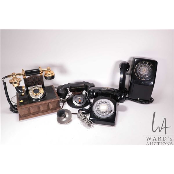 4 Vintage phones including a Western Electric DI phone, 2 dial desk phones, and a wall phone