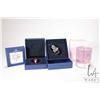 Image 1 : Four Swarovski Crystal collectibles including three Christmas ornaments and a candle