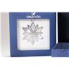 Image 2 : Four Swarovski Crystal collectibles including three Christmas ornaments and a candle