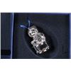 Image 4 : Four Swarovski Crystal collectibles including three Christmas ornaments and a candle