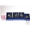 Image 1 : Five Swarovski Crystal collectibles including four Christmas ornaments and a candle