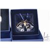 Image 6 : Five Swarovski Crystal collectibles including four Christmas ornaments and a candle
