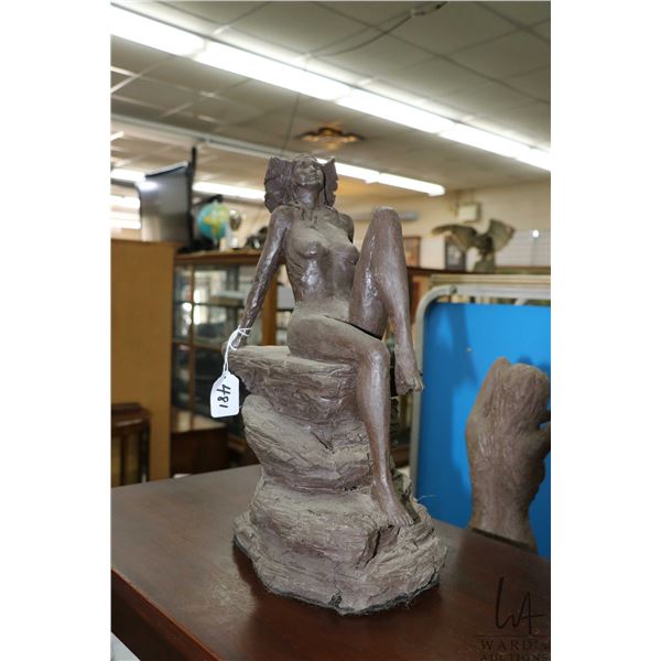 Kirsten Zuk, clay sculpture of a reclining nude woman, 16 1/2" in height, note: appears to have dama