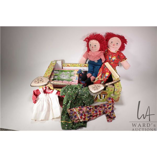 Selection of toys including Raggedy Ann and Andy with a selection of mummy made clothing and pajamas