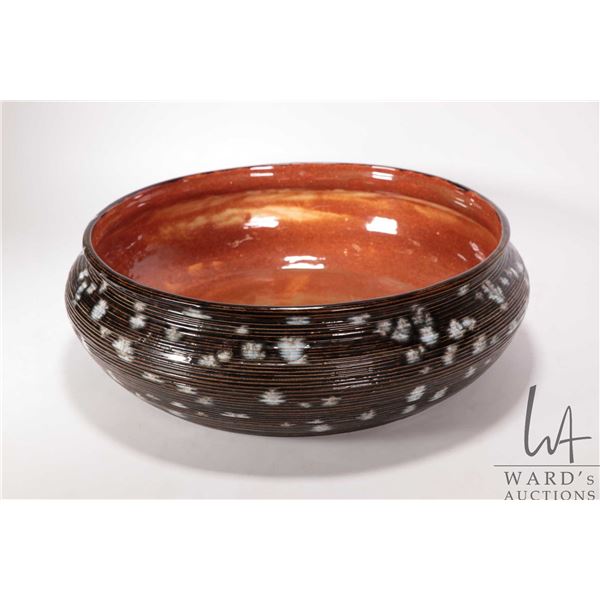 Artisan made drip glazed pottery bowl, initialled on underside "J H-1", 14" in diameter