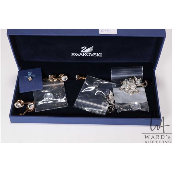 Selection of Swarovski pins plus a star pendant and diamante style elephant