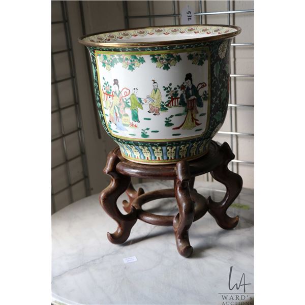 Chinese famille noire jardinere with garden scene 12" in diameter and includes wooden plinth