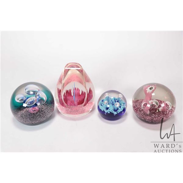 Four collectible paperweights including numbered Caithness, Scotland "Fantasy Orchid #1075", "Weathe
