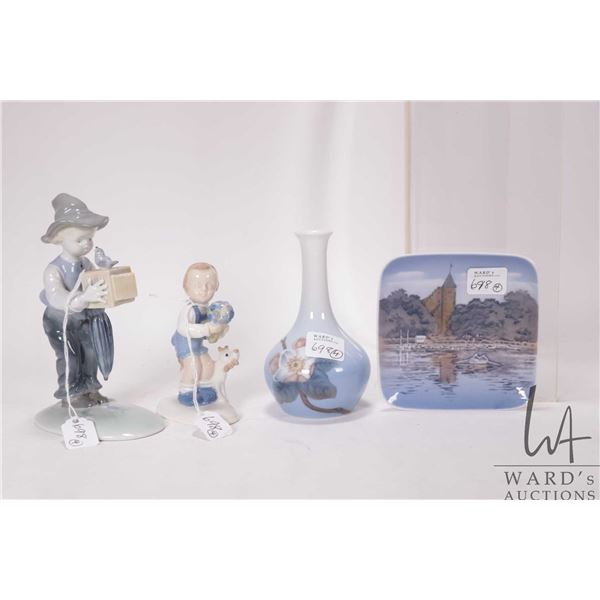 Four porcelain collectibles including two German figures of little boys, small Royal Copenhangen bud