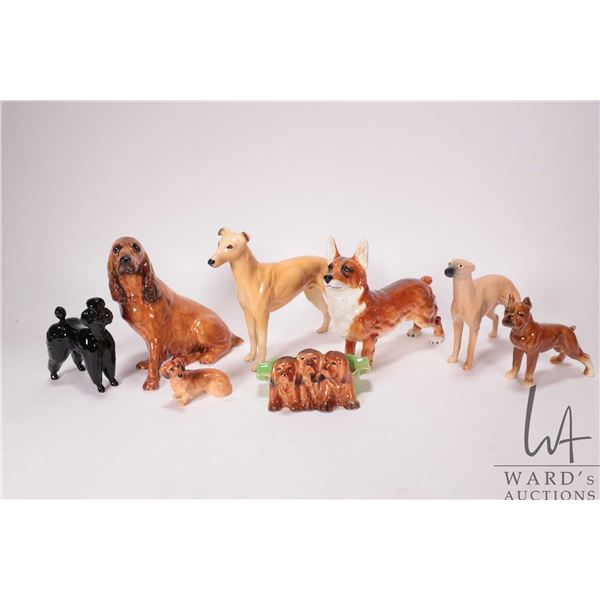 Eight vintage collectible dog figurines including Beswick, Coalport, Royal Doulton and Goebel