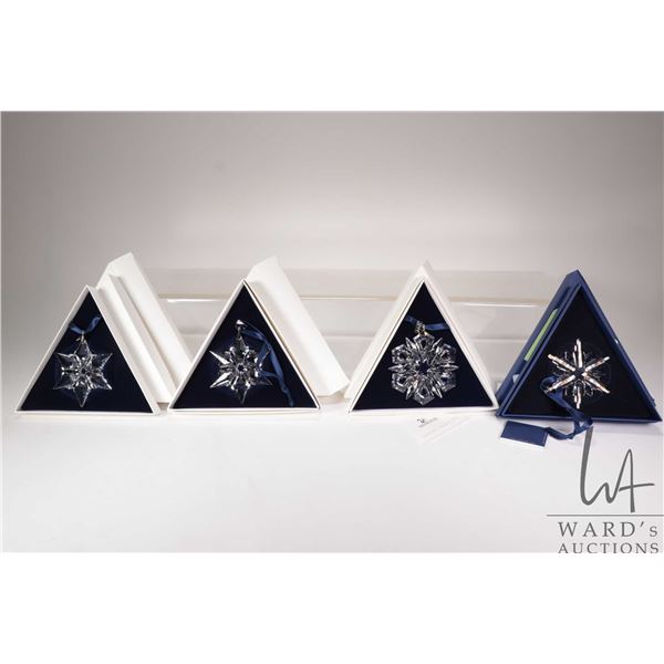 Four Swarovski Crystal collectible snowflakes including 2 X 2000, 1999 and 2006