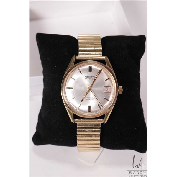 Vintage Gruen Precision Automatic Incabloc wrist watch with day indicator, with gold tone stainless 