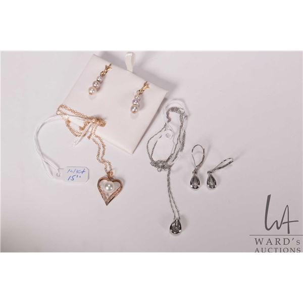 10kt white gold 18" neck chain with tear drop pendant set with small diamond plus matching earrings 