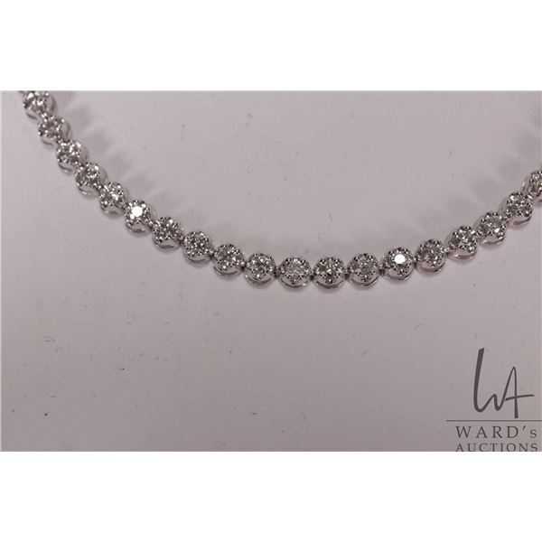 10kt white gold and diamond bracelet, set with 1.00cts. of round full cut natural diamonds, 7" in le