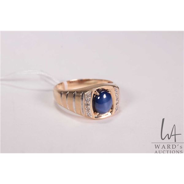 Gent's 10kt yellow gold ring set with synthetic blue star sapphire and .005cts of round single cut d