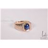 Image 1 : Gent's 10kt yellow gold ring set with synthetic blue star sapphire and .005cts of round single cut d
