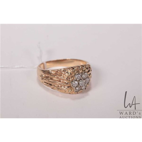 Gent's 10kt yellow gold and diamond ring, set with .63cts of round brilliant cut diamonds. Retail re