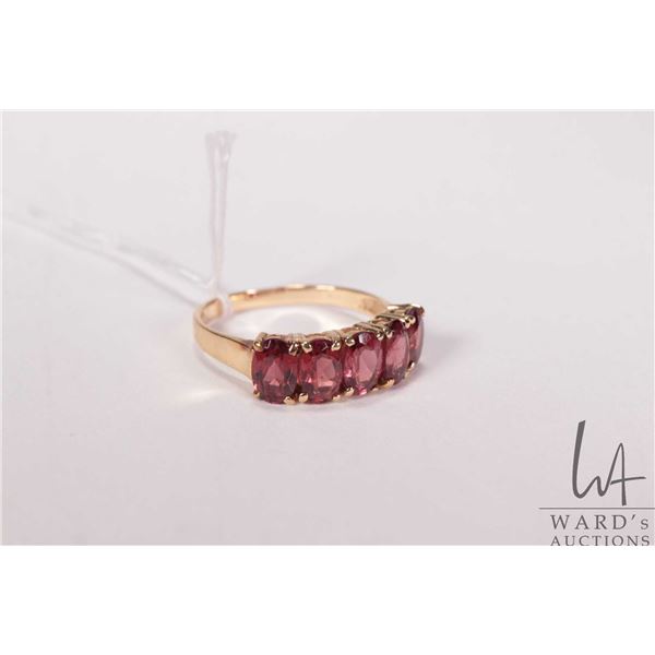 14kt yellow gold and genuine garnet five stone ring, size 7