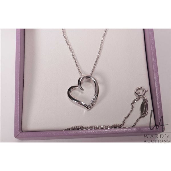 Michael Hill .925 sterling silver heart shaped heart shaped pendant set with three small accent diam