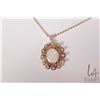 Image 1 : Tested 14kt yellow gold and opal pendant on 17" gold toned neck chain