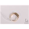 Image 3 : Vintage 18kt yellow gold ring set with three dark blue sapphire gemstones and four accent diamonds. 