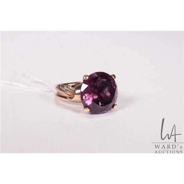 14kt yellow gold and round cut synthetic purple sapphire gemstone, size 6.75