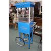 Image 1 : Fountain style popcorn maker machine, appears new with warming light, accessories and machine cart o