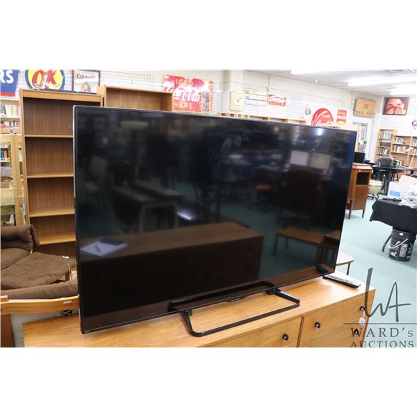 Sharp LCD television, model LC-70LE660U with remote and working at time of cataloguing