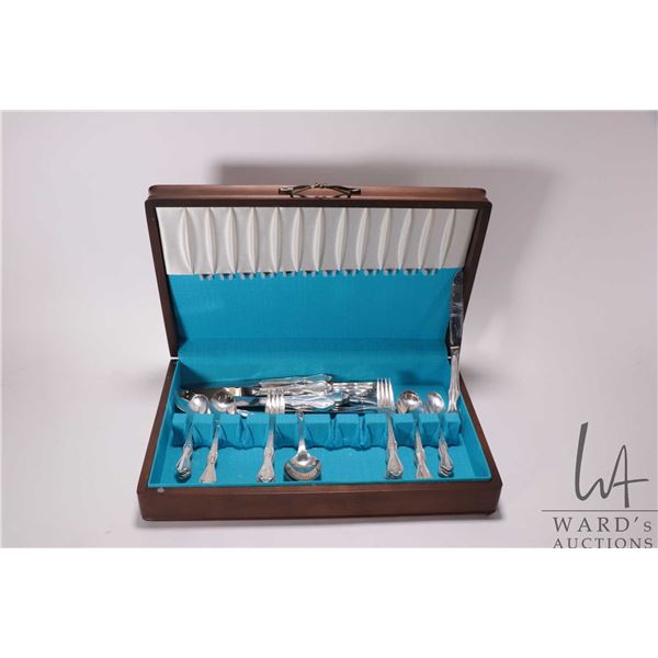 Wooden canteen containing International silver plate flatware including settings for eight of dinner