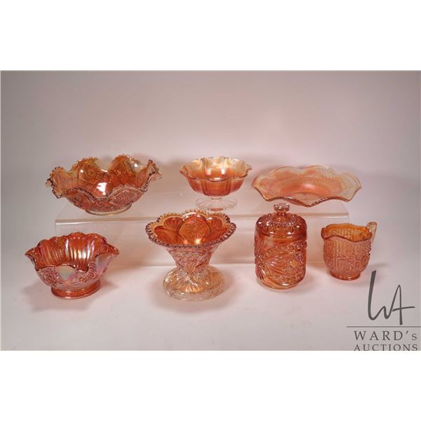 Seven pieces of vintage Carnival glass including hobnail, ruffled bowls, lidded canister, spill vase