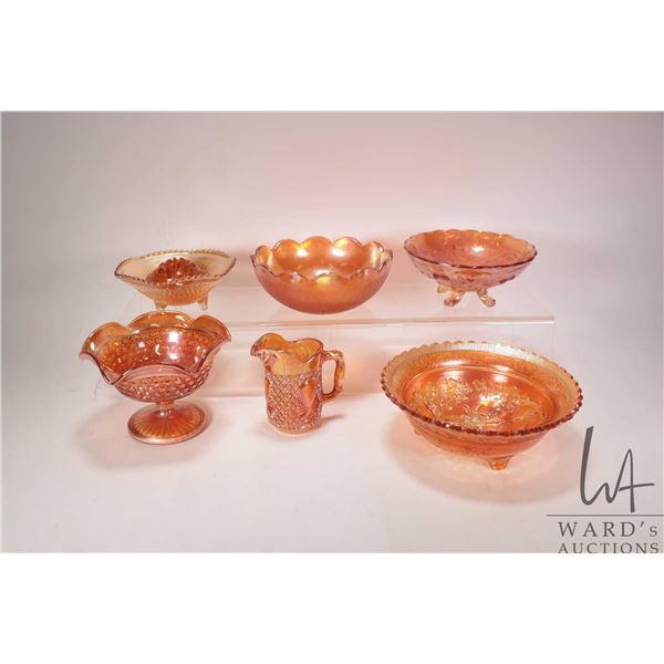 Seven pieces of vintage Carnival glass including bowls, pitcher, pedestal dish and a flower frog