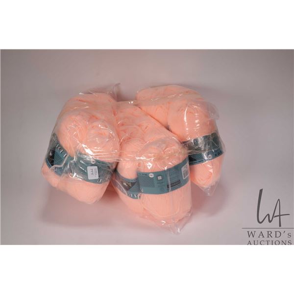 Twenty balls of Courtelle 50 gram 3 ply yarn in light coral pink