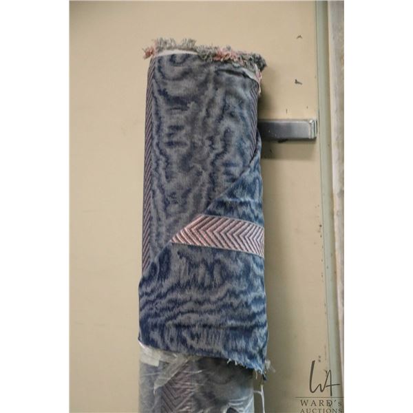 Bolt of upholstery fabric in hues of blues with pink herringbone stripe, yardage unknown