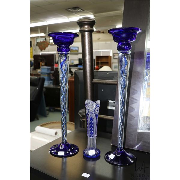 Pair of 20" table cobalt and clear glass candlesticks with internal twist and 9" cobalt cut to clear