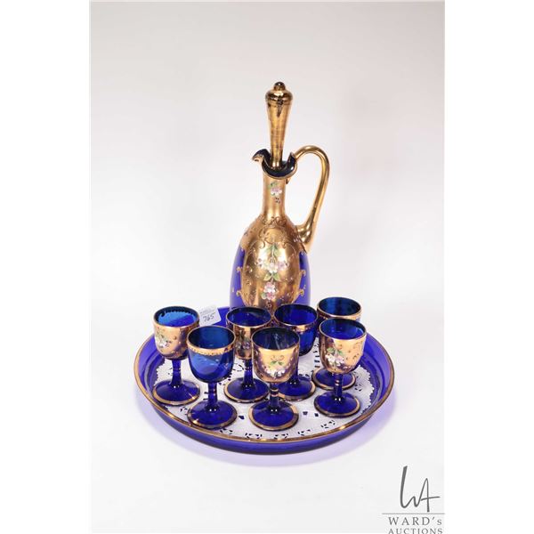Vintage hand painted Bohemian gilt and cobalt glass drinks set including lidded decanter, seven glas