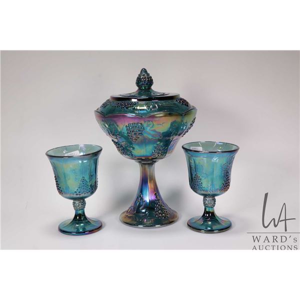 Three pieces of vintage blue Carnival glass including lidded 10 1/2" comport and two goblets
