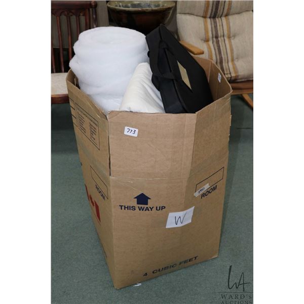 Box containing a large selection of quilt batting and backing including flannel and fiberfill etc.